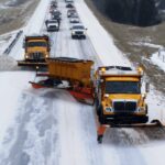 chain of snowplows for highway