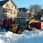 bobcat dumping snow